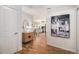 Entryway with stylish decor and a glimpse into the kitchen and dining area at 1044 Rockhurst Dr # 207, Highlands Ranch, CO 80129