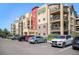 Contemporary apartment building featuring private balconies and a convenient parking area at 1044 Rockhurst Dr # 207, Highlands Ranch, CO 80129