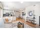 Open-concept living and kitchen area, perfect for entertaining guests or relaxing at 1044 Rockhurst Dr # 207, Highlands Ranch, CO 80129
