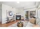Relaxing living room area with fireplace, balcony and stylish furniture at 1044 Rockhurst Dr # 207, Highlands Ranch, CO 80129