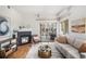 Inviting living room with a fireplace, sliding glass doors, and comfortable furnishings at 1044 Rockhurst Dr # 207, Highlands Ranch, CO 80129