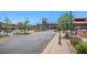 Street view of Highlands Ranch Town Center with clock tower, shopping, and parking on a sunny day at 1044 Rockhurst Dr # 207, Highlands Ranch, CO 80129