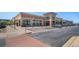 Exterior street view showing shops like Xfinity and Michaels, with ample parking, brick sidewalks, and landscaping at 1044 Rockhurst Dr # 207, Highlands Ranch, CO 80129