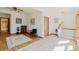 Cozy entryway with tile and hardwood flooring leading to stairs and other rooms at 12135 Cochise Cir, Conifer, CO 80433