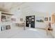 Bright studio featuring white walls, vaulted ceilings, and natural light from multiple windows at 12135 Cochise Cir, Conifer, CO 80433
