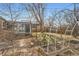 View of the sunroom from the backyard with raised garden beds at 755 Newark St, Aurora, CO 80010