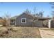 Charming single story home with covered carport and cozy front yard at 755 Newark St, Aurora, CO 80010