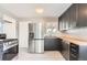 Updated kitchen features stainless steel appliances, new countertops, and stylish backsplash at 755 Newark St, Aurora, CO 80010