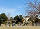 Community playground with mature trees at 755 Newark St, Aurora, CO 80010