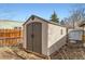 Storage shed with wooden base and double doors, providing outdoor storage space at 755 Newark St, Aurora, CO 80010