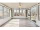 Bright sunroom with many windows providing ample natural light and views of the outdoors at 755 Newark St, Aurora, CO 80010