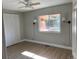 Bedroom with a ceiling fan, window with blinds, sconce lighting, and a closet with folding doors at 1415 Bacchus Dr # D9, Lafayette, CO 80026