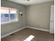 Bedroom featuring a window, neutral wall paint, vinyl floors, and modern sconce lighting at 1415 Bacchus Dr # D9, Lafayette, CO 80026