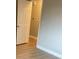 Hallway view featuring wood floors and a crisp white door at 1415 Bacchus Dr # D9, Lafayette, CO 80026