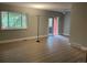 Living room featuring neutral wall paint, vinyl floors, standing lamp and window with a view at 1415 Bacchus Dr # D9, Lafayette, CO 80026