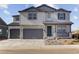 Charming two-story home featuring a three-car garage and covered porch, perfect for a growing Gathering at 3983 Breakcamp Ct, Castle Rock, CO 80108