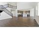 Spacious living room with soaring ceilings, hardwood floors, and a grand staircase at 3983 Breakcamp Ct, Castle Rock, CO 80108