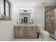 Beautiful bathroom features dual sinks, modern vanity, and updated shower at 4028 S Atchison Way, Aurora, CO 80014