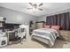 Bedroom featuring neutral colors, closet, and additional desk and dresser for storage at 4028 S Atchison Way, Aurora, CO 80014