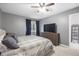 Comfortable bedroom features ceiling fan, closet, and adjacent ensuite bathroom at 4028 S Atchison Way, Aurora, CO 80014