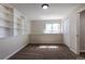 Comfortable bedroom with neutral carpet, built-in shelving, window and a closet at 11524 Marshall Ct, Broomfield, CO 80020