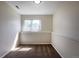 Bright bedroom featuring neutral walls, carpet, window, and base trim at 11524 Marshall Ct, Broomfield, CO 80020
