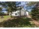 Home exterior featuring lush green grass and mature trees at 11524 Marshall Ct, Broomfield, CO 80020