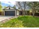 Charming single Gathering home featuring stone accents, a two-car garage, and a well-manicured front lawn at 11524 Marshall Ct, Broomfield, CO 80020
