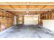 Two car garage featuring unfinished walls and ceiling with concrete floors at 11524 Marshall Ct, Broomfield, CO 80020
