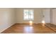 Bright living room featuring hardwood floors, a large window, and neutral paint, creating a cozy atmosphere at 11524 Marshall Ct, Broomfield, CO 80020