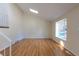 Inviting living room with high ceilings, hardwood floors, a large window, and a skylight at 11524 Marshall Ct, Broomfield, CO 80020