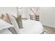 Bright bedroom features a comfortable bed with stylish pillows, and access to a balcony at 2275 S Yosemite Cir, Denver, CO 80231