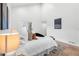 Large main bedroom showing decor and natural light from the sliding door at 2275 S Yosemite Cir, Denver, CO 80231