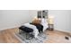 The main bedroom is bright with an area rug and stylish decor at 2275 S Yosemite Cir, Denver, CO 80231