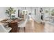 Bright dining room features a round table, modern chairs, and lots of natural light at 2275 S Yosemite Cir, Denver, CO 80231