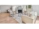 Well-lit living room features a fireplace, modern furniture, and an open layout for flexible living at 2275 S Yosemite Cir, Denver, CO 80231