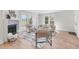 Bright living room with a fireplace, modern furniture, and ample natural light for a cozy atmosphere at 2275 S Yosemite Cir, Denver, CO 80231