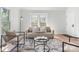 Inviting living room with modern furniture, a stylish rug, and plenty of natural light for comfortable living at 2275 S Yosemite Cir, Denver, CO 80231