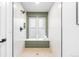 This modern shower features tiled walls and a bright window at 2275 S Yosemite Cir, Denver, CO 80231