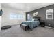 Spacious bedroom features plush carpet, natural light and a cozy spot for your furry friend at 11023 Pastel Pt, Parker, CO 80134