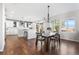 Elegant dining area adjacent to the kitchen with natural light and ample seating at 11023 Pastel Pt, Parker, CO 80134