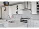 Stylish kitchen features quartz countertops, stainless steel appliances, and custom tile backsplash at 11023 Pastel Pt, Parker, CO 80134