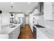 Well-designed kitchen features a large island, stainless steel appliances, and custom cabinetry at 11023 Pastel Pt, Parker, CO 80134