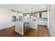 Spacious kitchen featuring a large island, stainless steel appliances, and a sleek, modern design at 11023 Pastel Pt, Parker, CO 80134