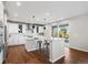 Open-concept kitchen with a marble island, stainless steel appliances, and easy access to the outdoor space at 11023 Pastel Pt, Parker, CO 80134