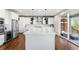 Modern kitchen with a large center island, stainless steel appliances, and ample cabinet space at 11023 Pastel Pt, Parker, CO 80134