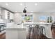 Bright kitchen with large island, stainless steel appliances, and pendant lighting at 11023 Pastel Pt, Parker, CO 80134