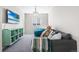 Inviting living room with plush seating, vibrant beanbag chairs, and a mounted television for entertainment at 11023 Pastel Pt, Parker, CO 80134