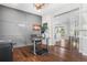 Well-lit home office with hardwood floors, modern desk and glass-enclosed additional office space at 11023 Pastel Pt, Parker, CO 80134