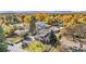 Stunning aerial view of home with beautiful, lush landscaping and mature trees in the surrounding neighborhood at 1945 Yarrow St, Lakewood, CO 80214